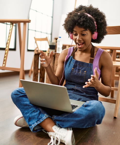 Young african-american woman using laptop